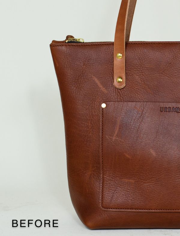 A leather zipper tote, before it has been conditioned & scratches removed.