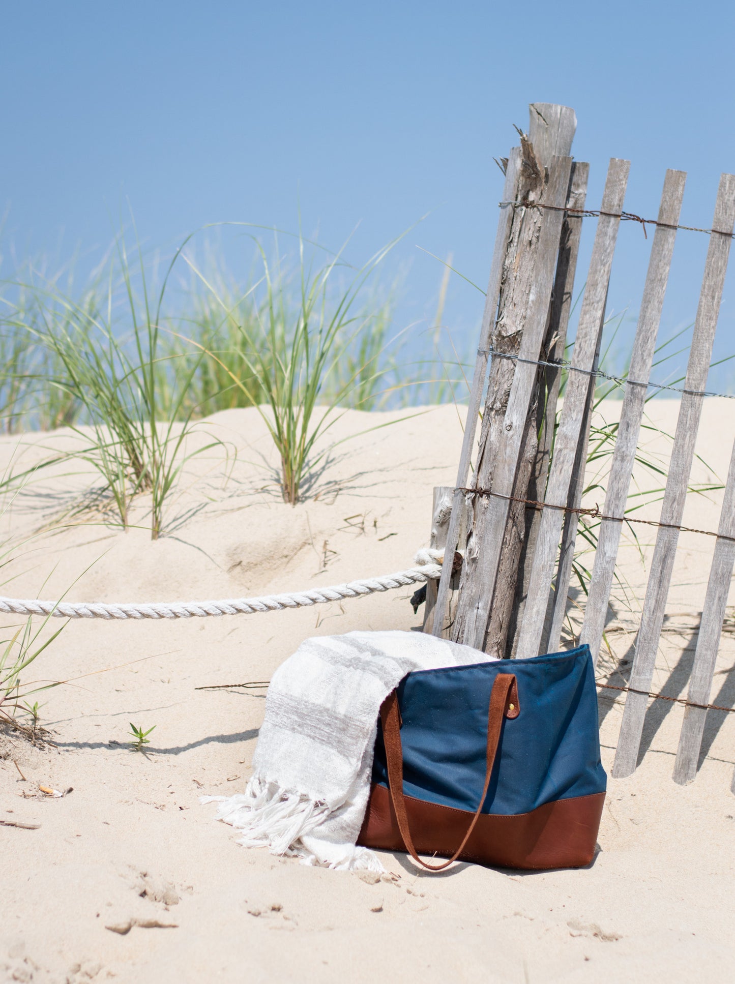 With its leather bottom, canvas body, and large storage size, the Urban Southern Large Canvas Tote is the perfect bag for the beach.