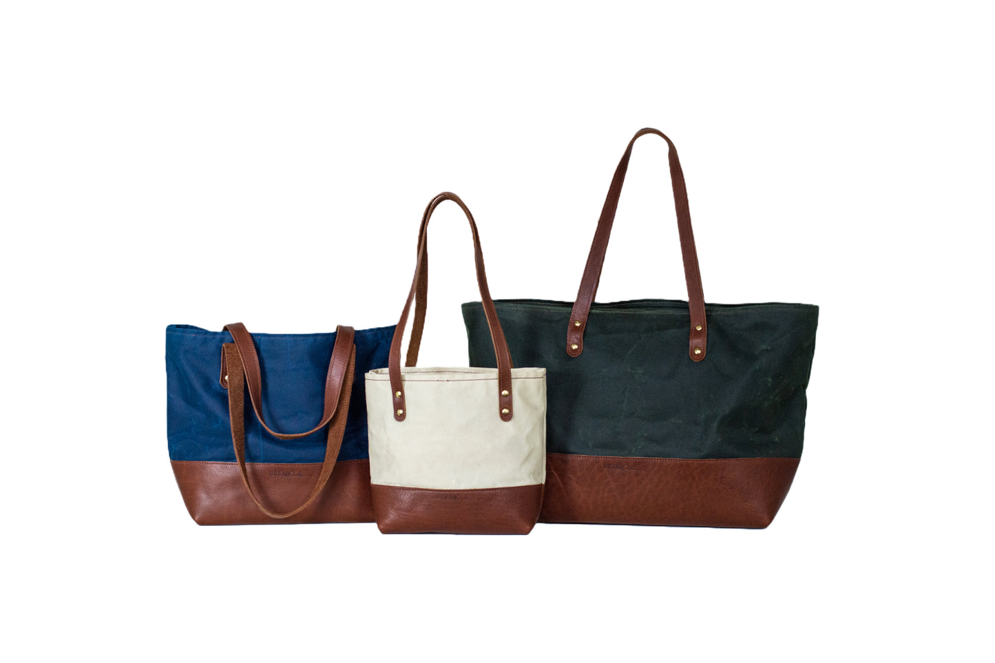 Side-by-side size comparison of 3 different Canvas Totes available: the Mini Canvas Tote, Classic Canvas Tote, and Large Canvas Tote