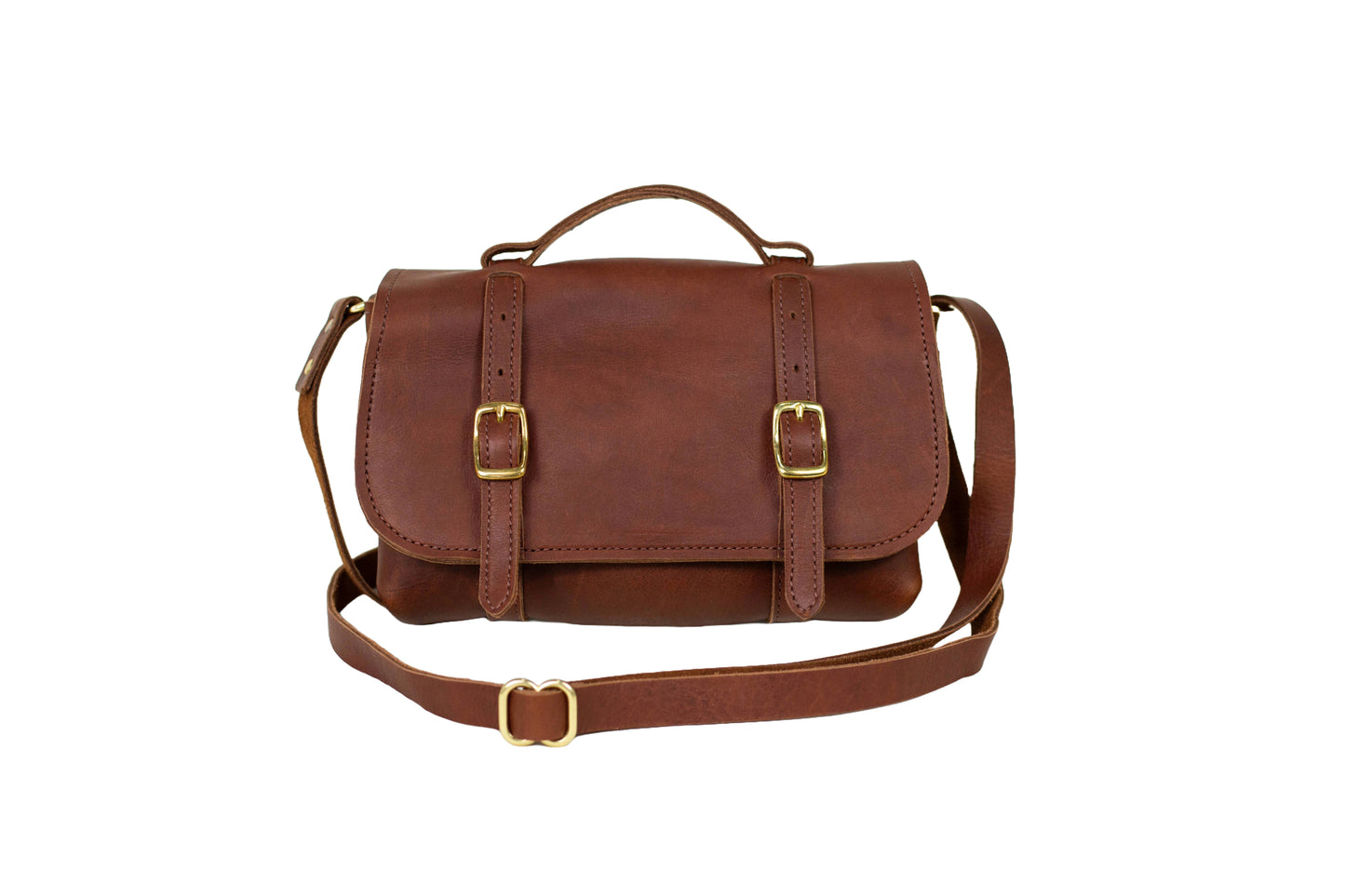 Handmade Leather Carriage Crossbody in Cognac with brass buckles and adjustable straps.