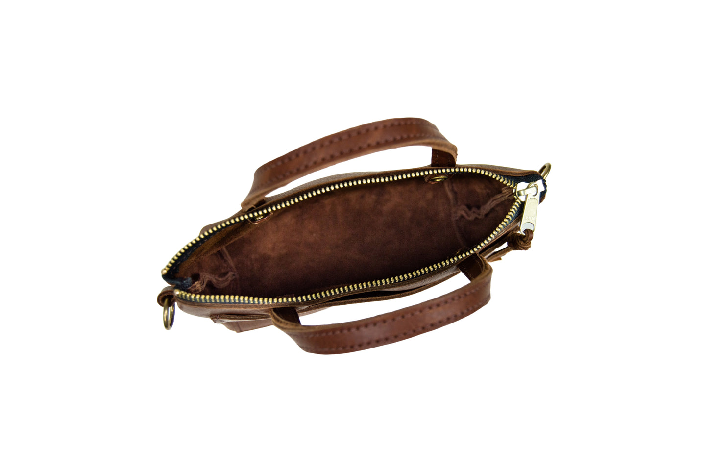 The interior of a Cassidy Crossbody, with its roomy compartment & brass zipper closure.