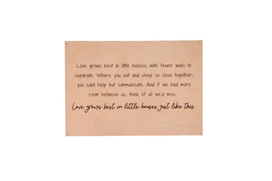 The Urban Southern handcrafted leather "Love Grows Best" sign.