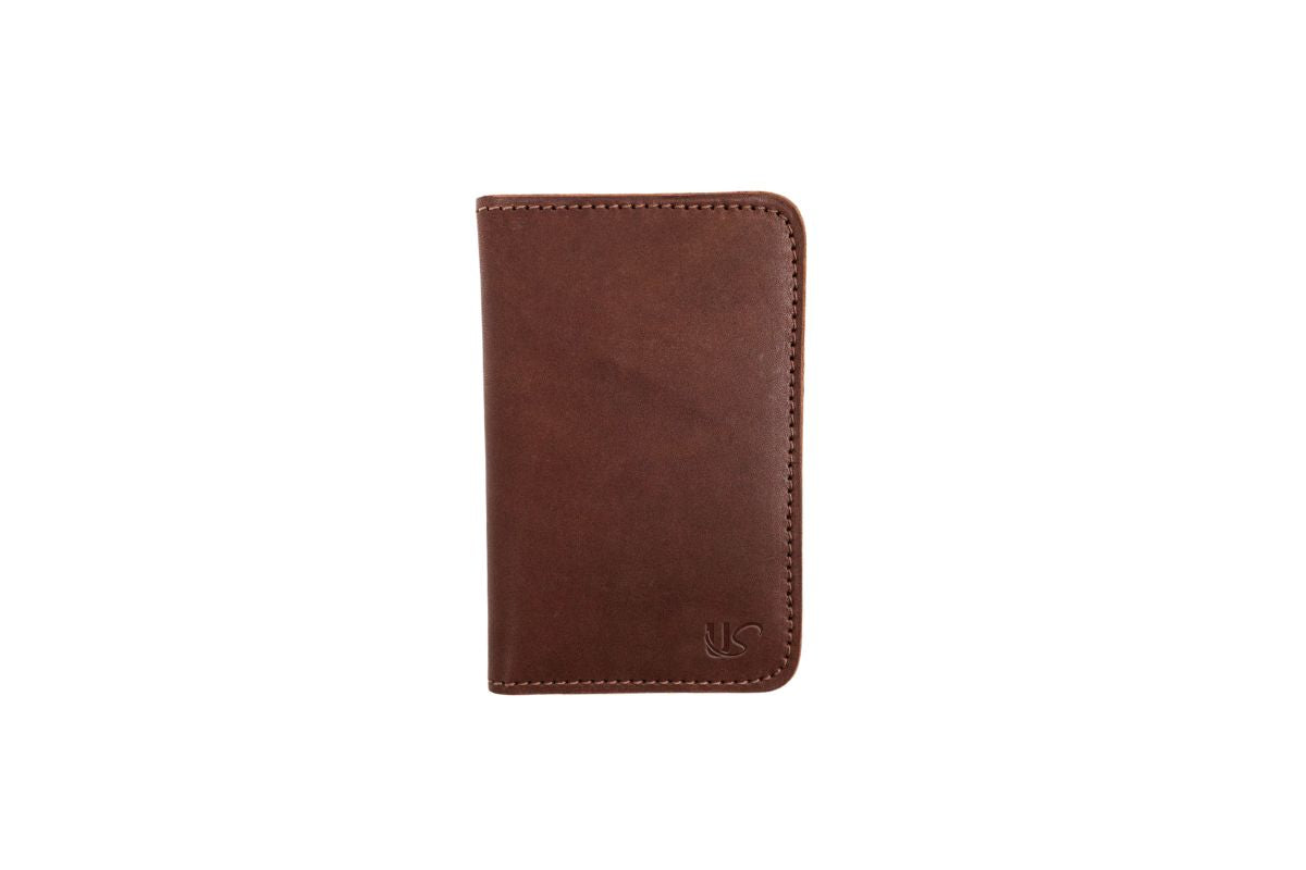 The full-grain leather Notebook Wallet, featuring a 48 page memo book & 2 interior credit card slots.