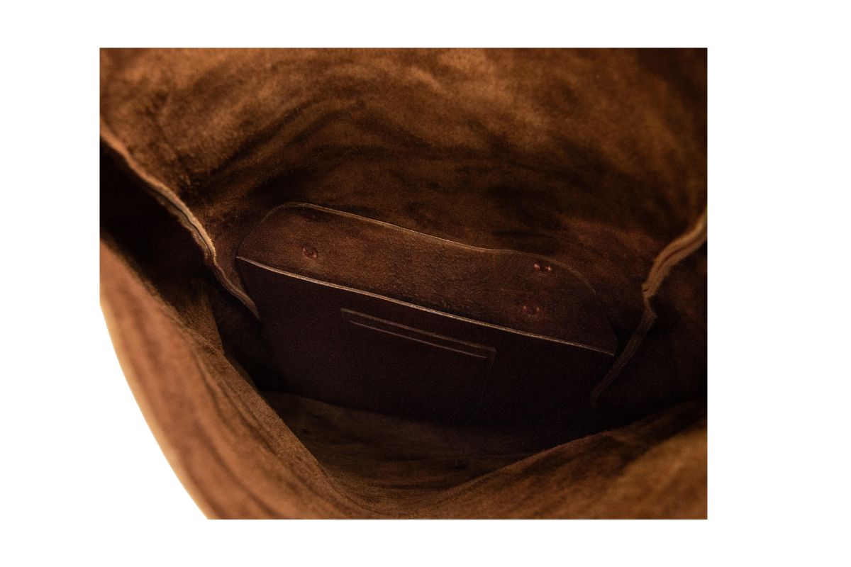 Close-up of interior pockets inside the rolltop backpack