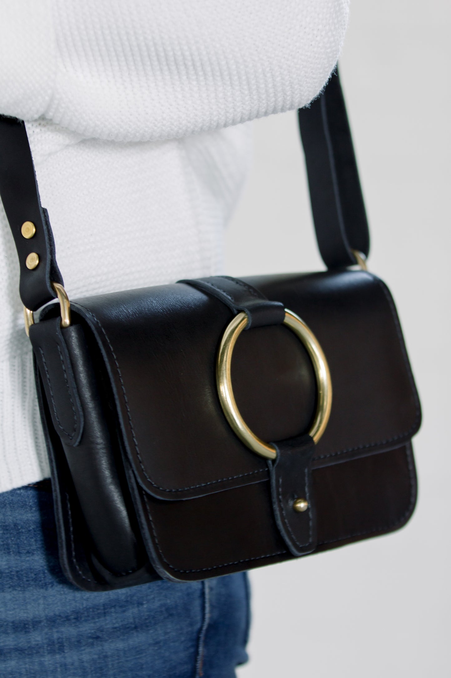 A side view of the 5-Pocket Crossbody Bag in Black.