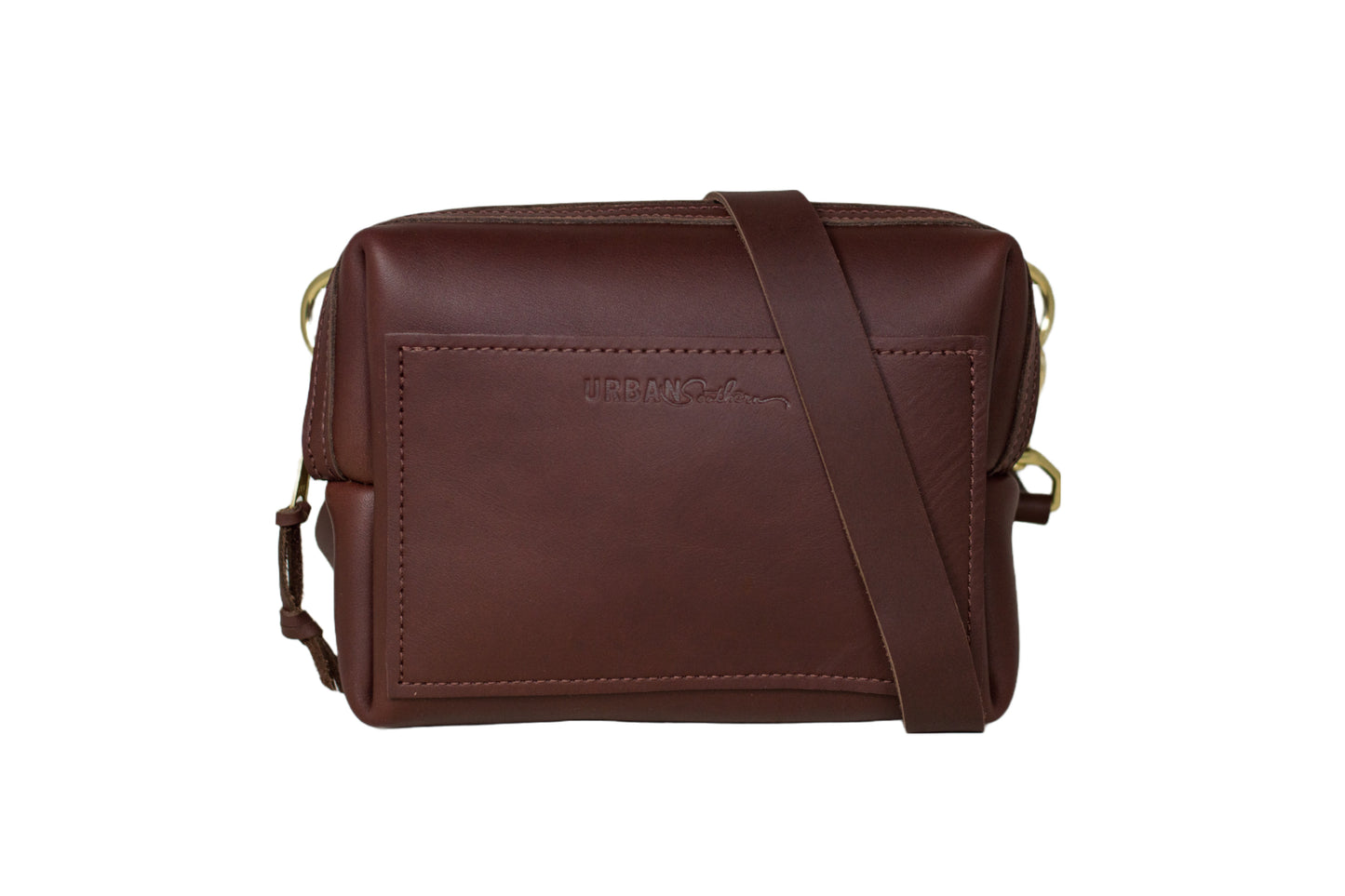 The Urban Sling, featuring full-grain leather, brass hardware, and an adjustable, removable strap.