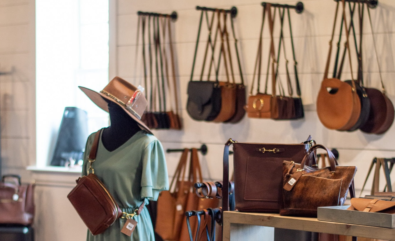 The Urban Southern store, withe table displaying a selection of leather-goods.