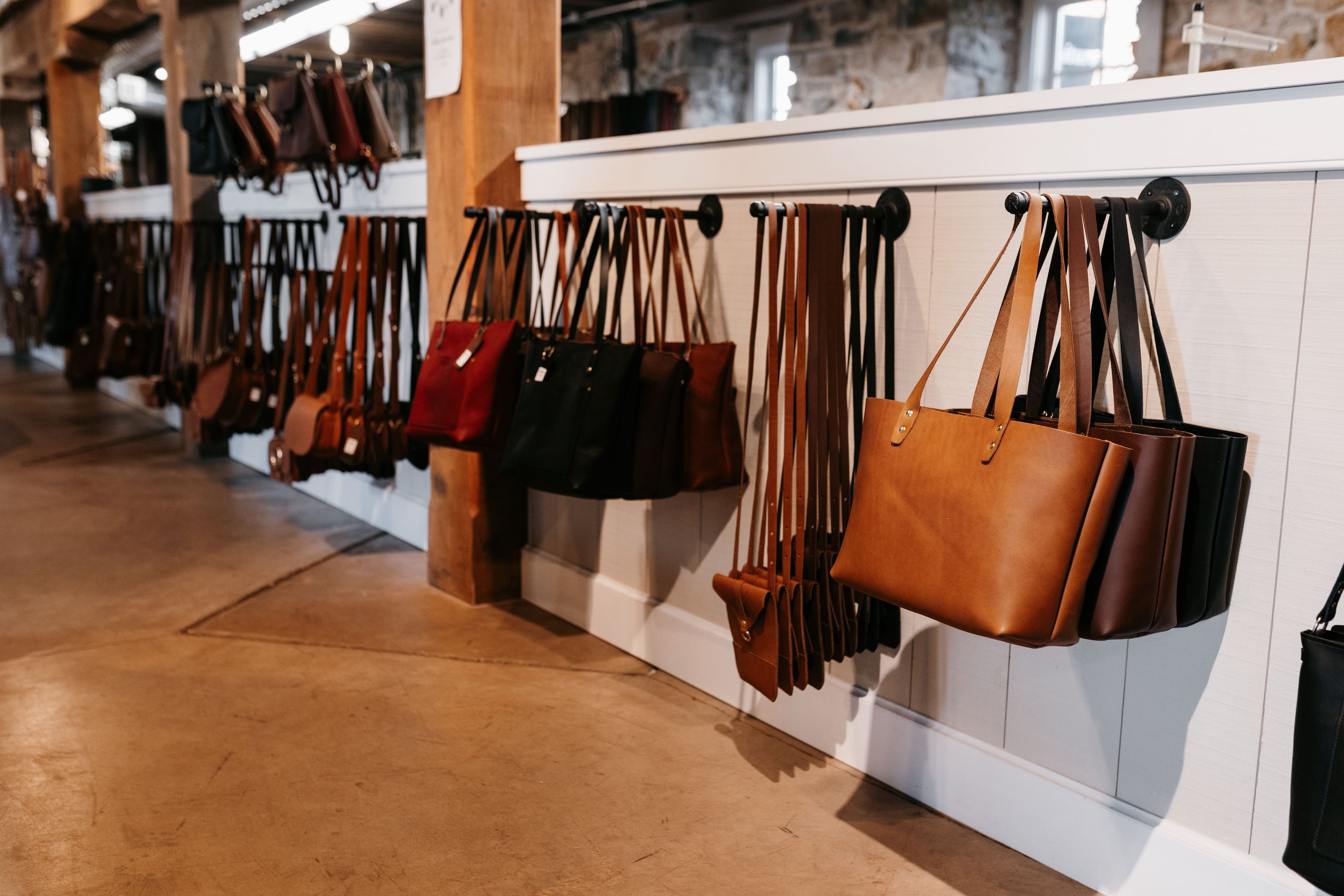 Handbags hanging on a wall in the Urban Southern store.