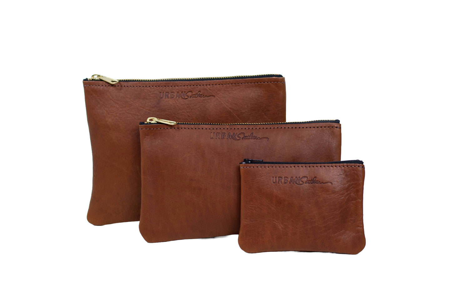 The Urban Southern handcrafted leather Zipper Pouch is available in three different sizes: mini, small, and large. Shown here in Cognac.