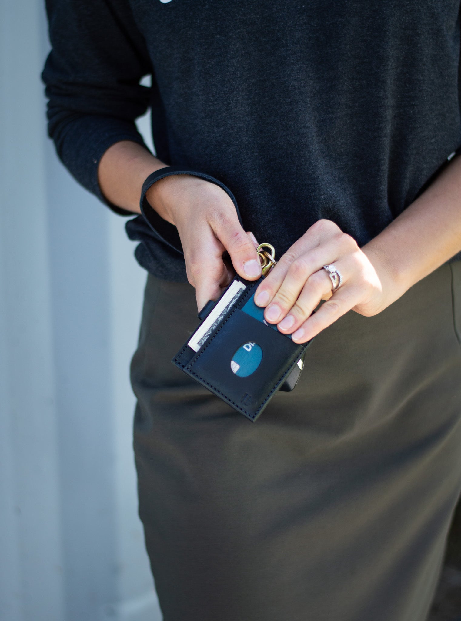 Carry your wallet and cards by attaching the Urban Southern Everly Wristlet Wallet to the Leather Wristlet brass clip.