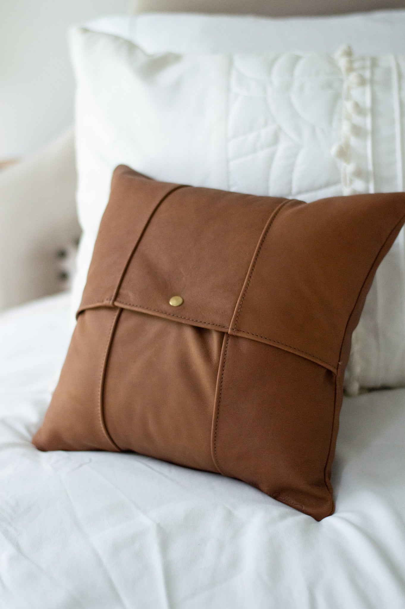 The back of the Small Leather Pillow, featuring a snap closure, making removing the pillow insert quick & easy.