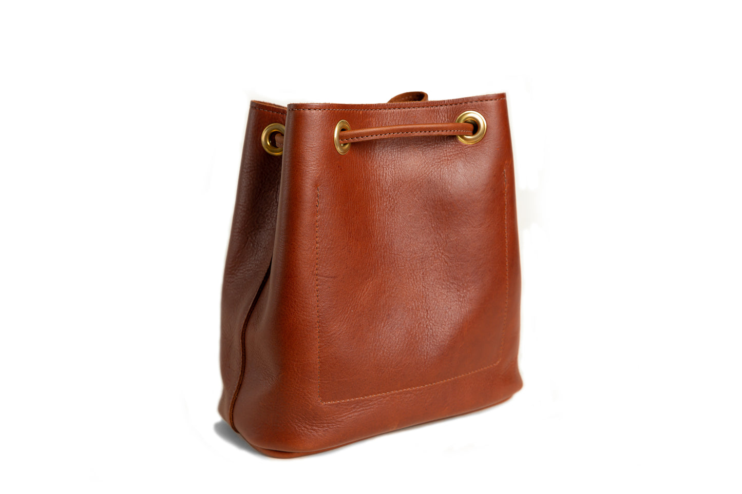 A back view of the Urban Bucket Bag in cognac.