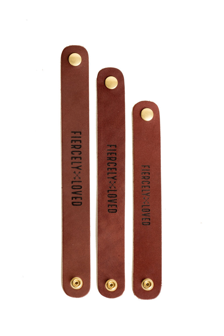 The Urban Southern Fiercely Loved leather cuff bracelet is available in three different sizes: Small, Medium, and Large.