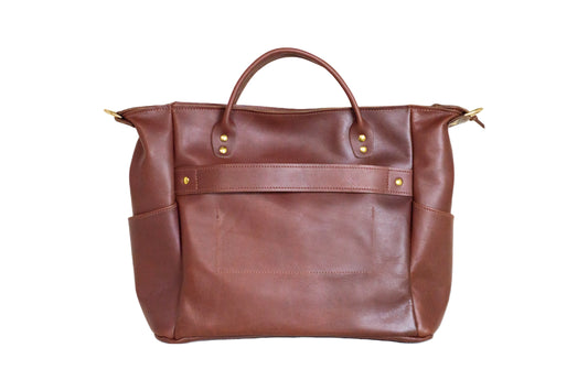 The back of the Urban Southern Legacy Voyager bag has a trolly sleeve strap attached to slip over your luggage handle for easy traveling.