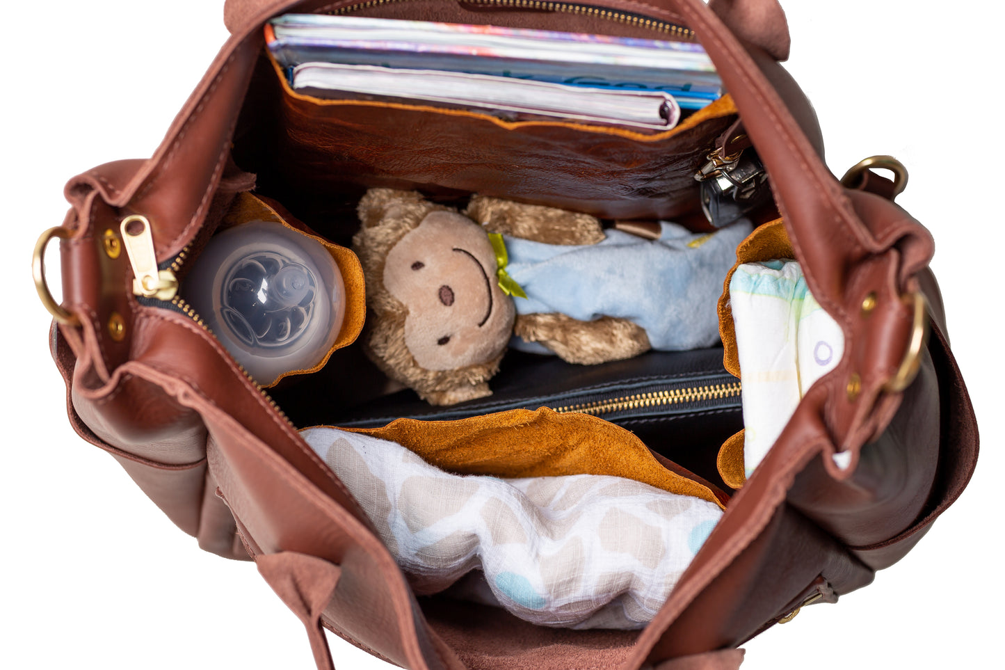 The Urban Southern handcrafted leather Legacy Backpack Tote makes the perfect diaper bag, carrying keys, books, bottles, diapers, blankets, and toys.