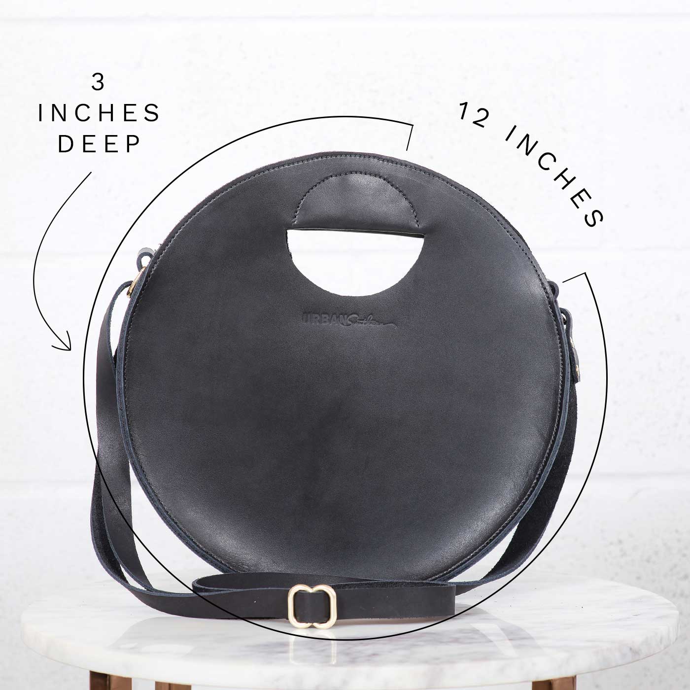 Dimensions of Britt Circle Crossbody Bag are 12 inches in diameter, and 3 inches deep.