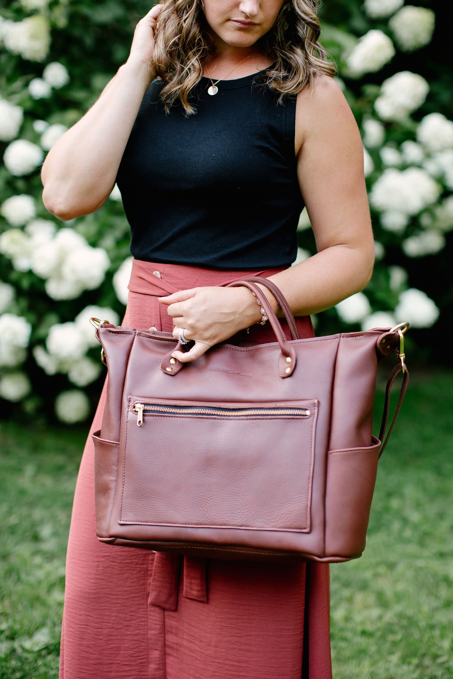 Use the handles to carry the Legacy Backpack Tote on your wrist.