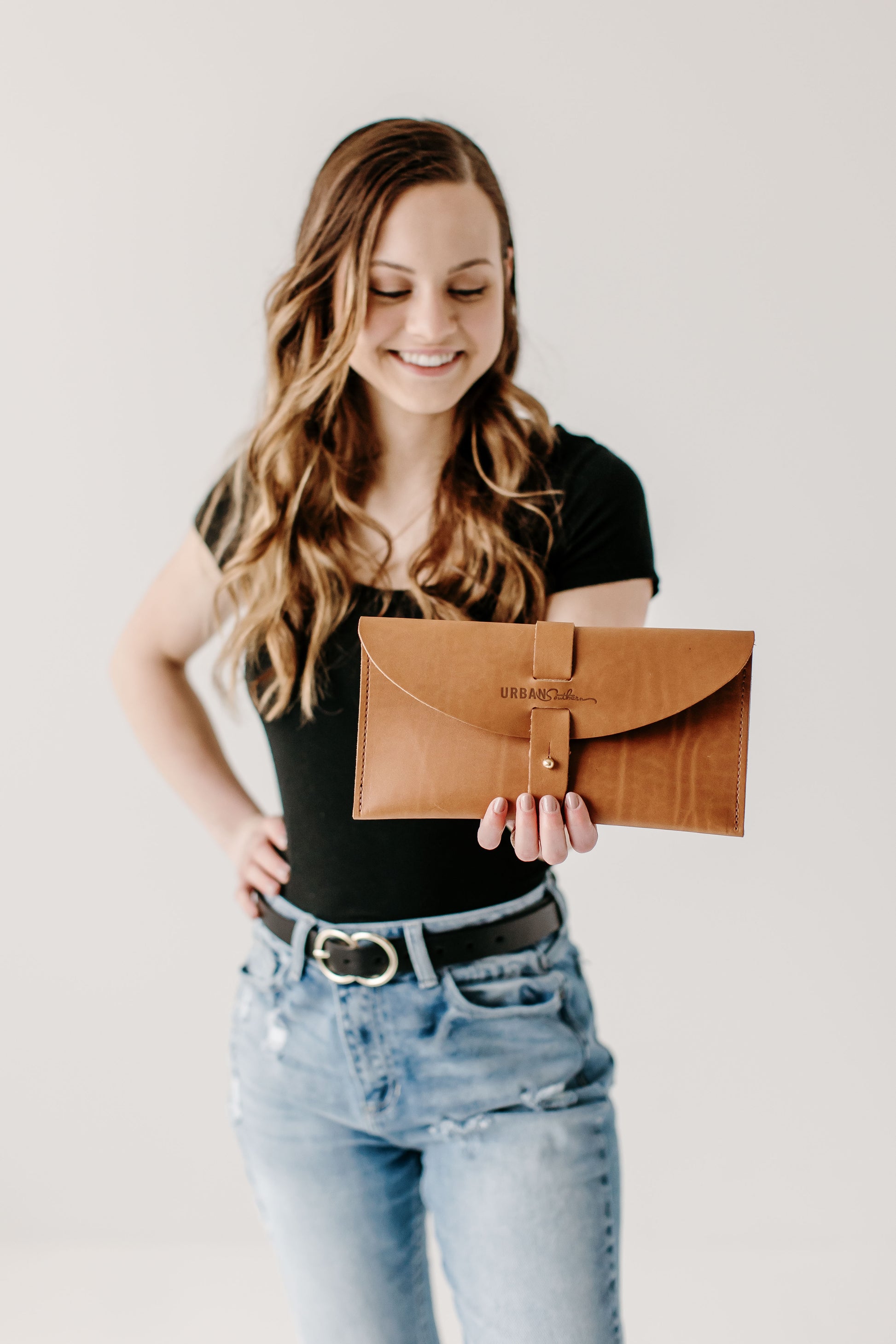 The Urban Southern handcrafted leather 5th Avenue Clutch in Honey.