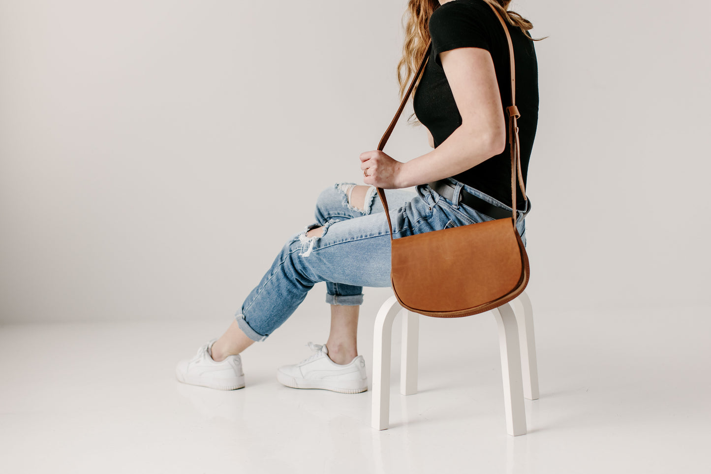 The Urban Southern handcrafted leather Half Moon Crossbody bag in Honey.