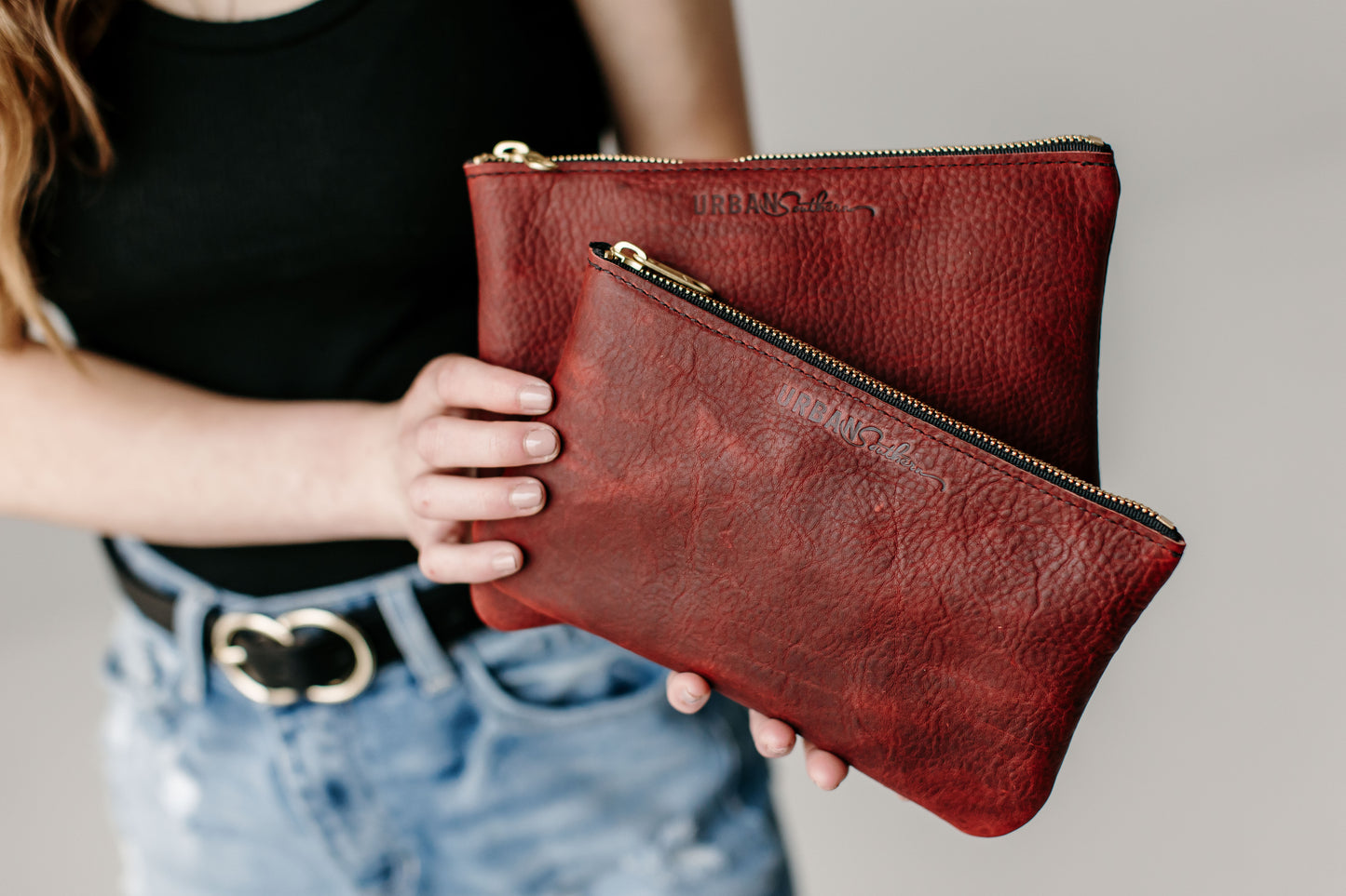The Zipper Pouch Set includes a Small and Large Zipper Pouch. Shown in Merlot.