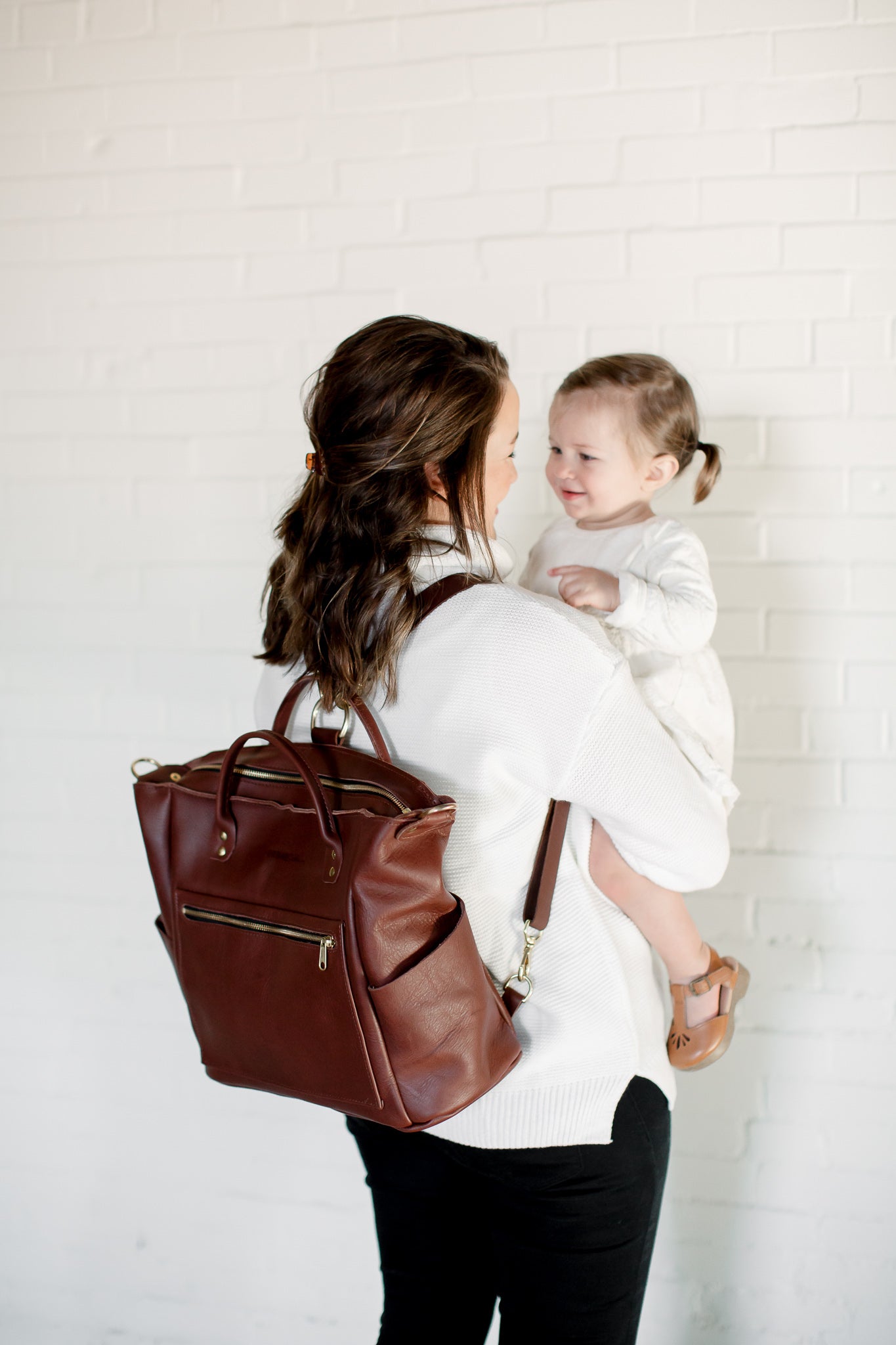 Carry the Legacy Backpack Tote as a backpack with both straps attached.