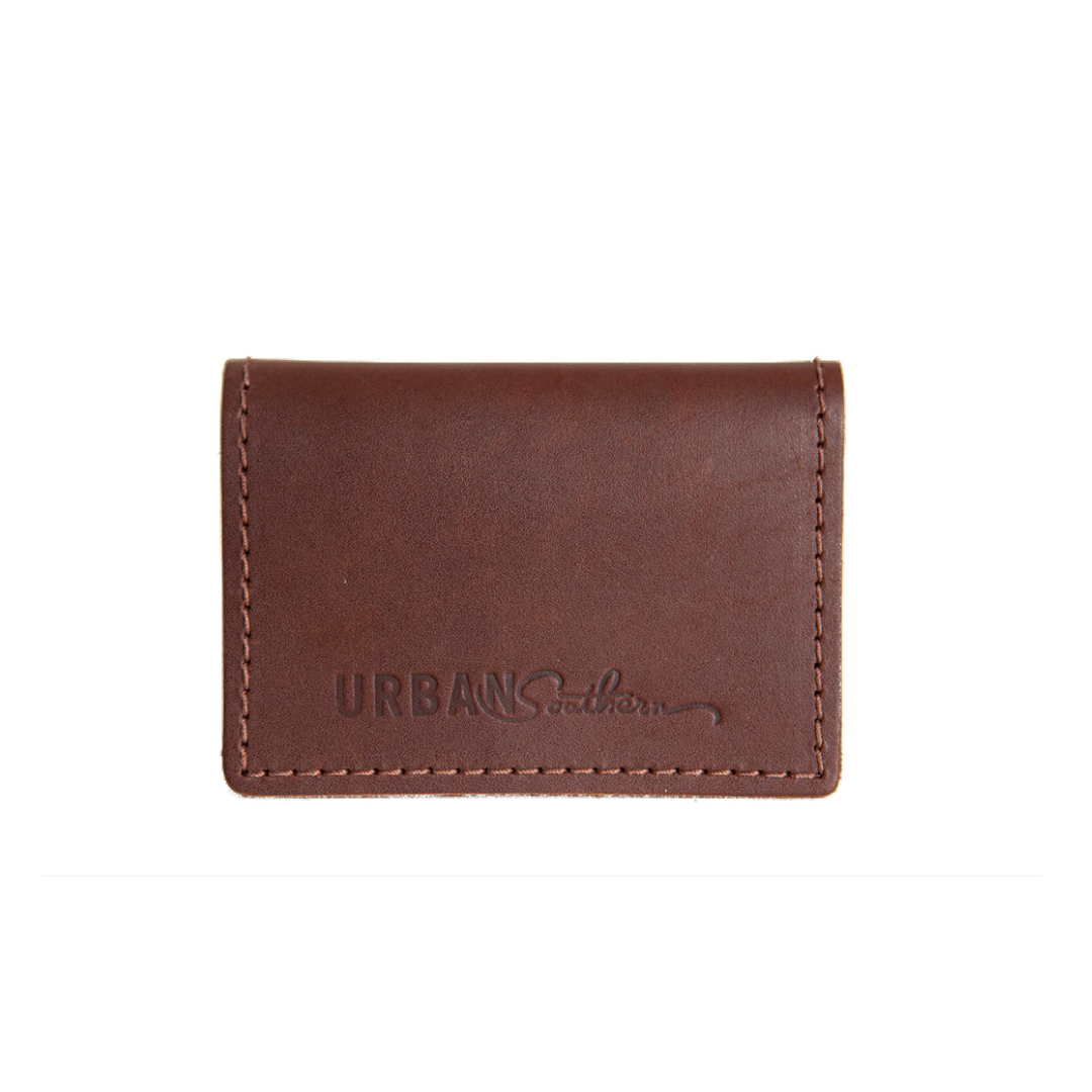 The handcrafted Leather Bifold Card Wallet in Chestnut Brown, with handmade stitching and engraved Urban Southern logo