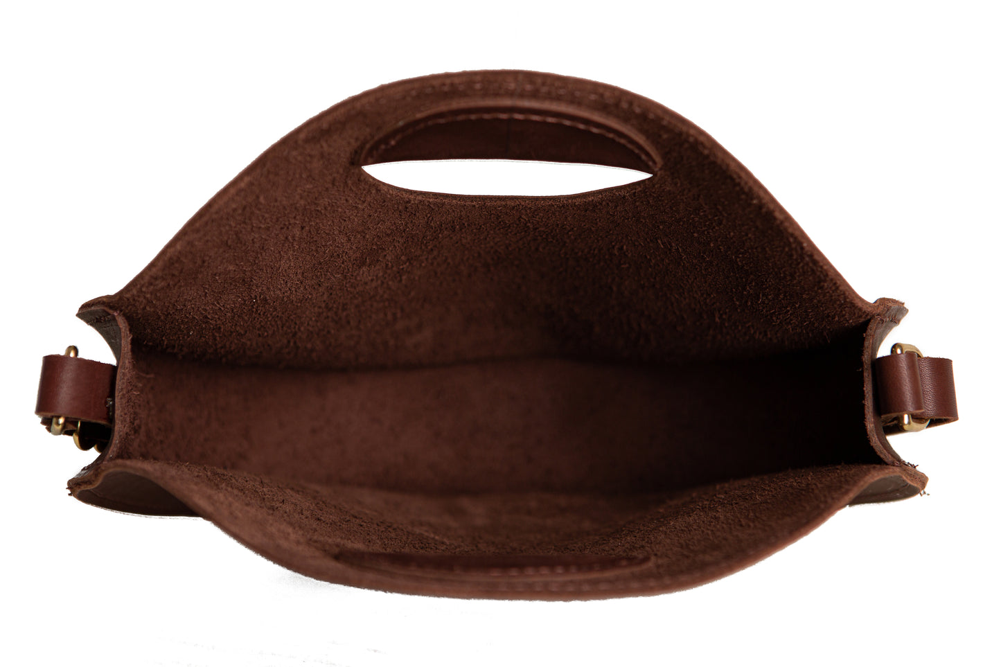 The inside storage area of the handcrafted leather Britt Circle Crossbody Bag.