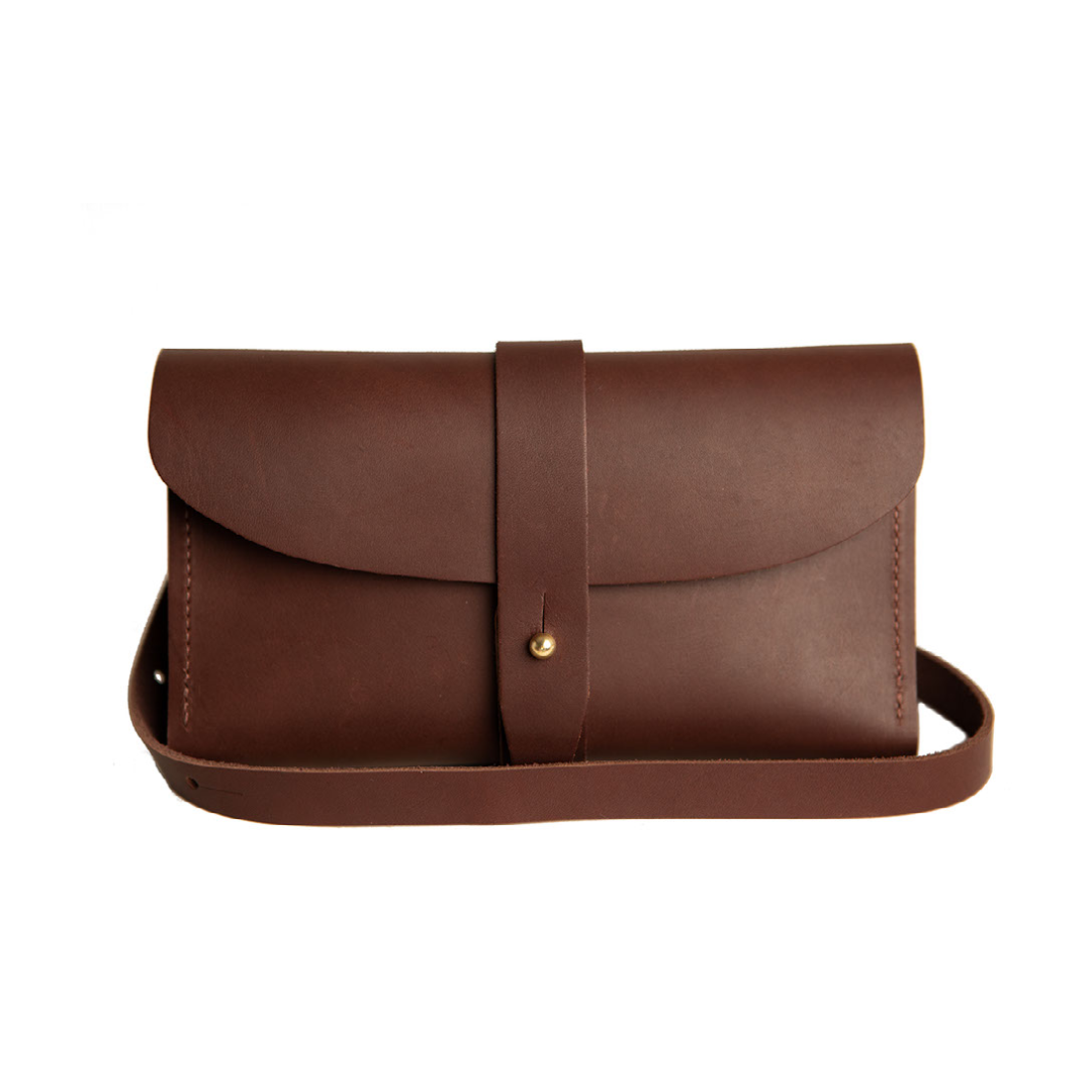 Urban Southern Handcrafted Leather Crossbody Wallet in Chestnut Brown, with removable and adjustable strap and brass post closures.