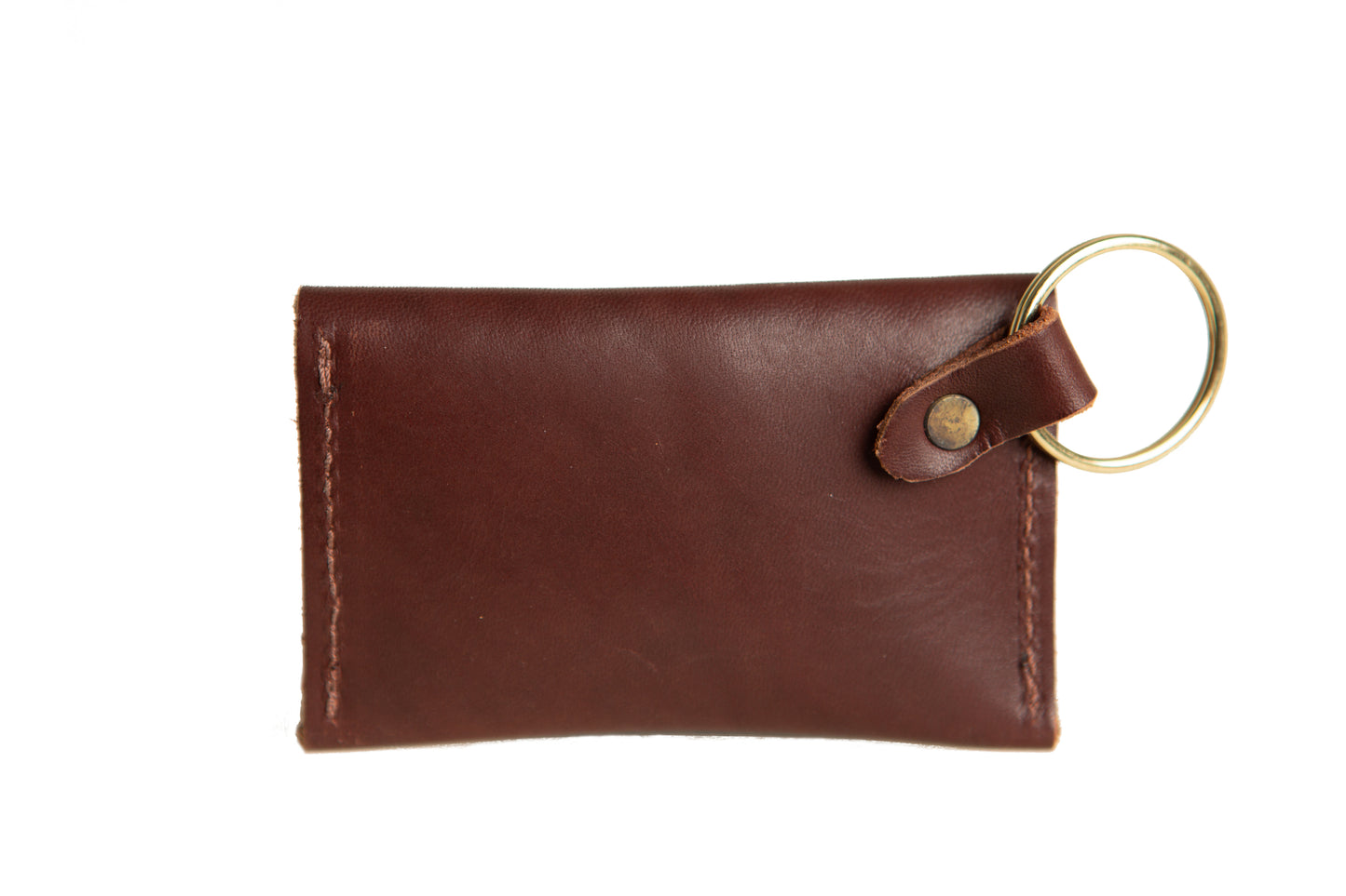 The brass ring is attached to the back of the Keychain Coin Purse using a leather loop and brass rivet.