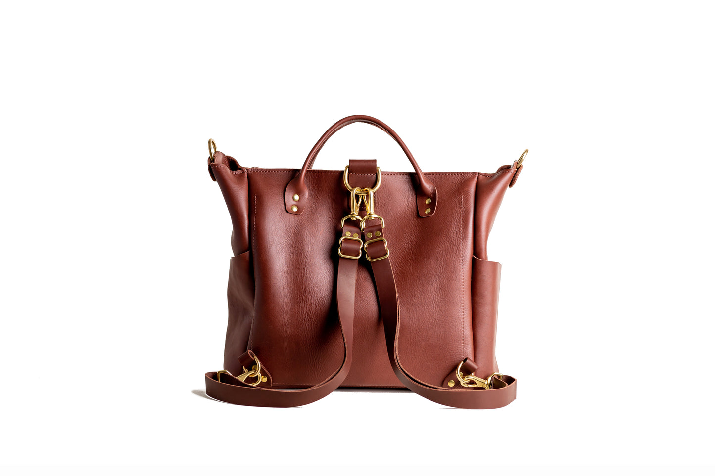 The adjustable straps on the back of Urban Southern handcrafted leather Legacy Backpack Tote are easily and quickly removed by the brass lever snap hooks.