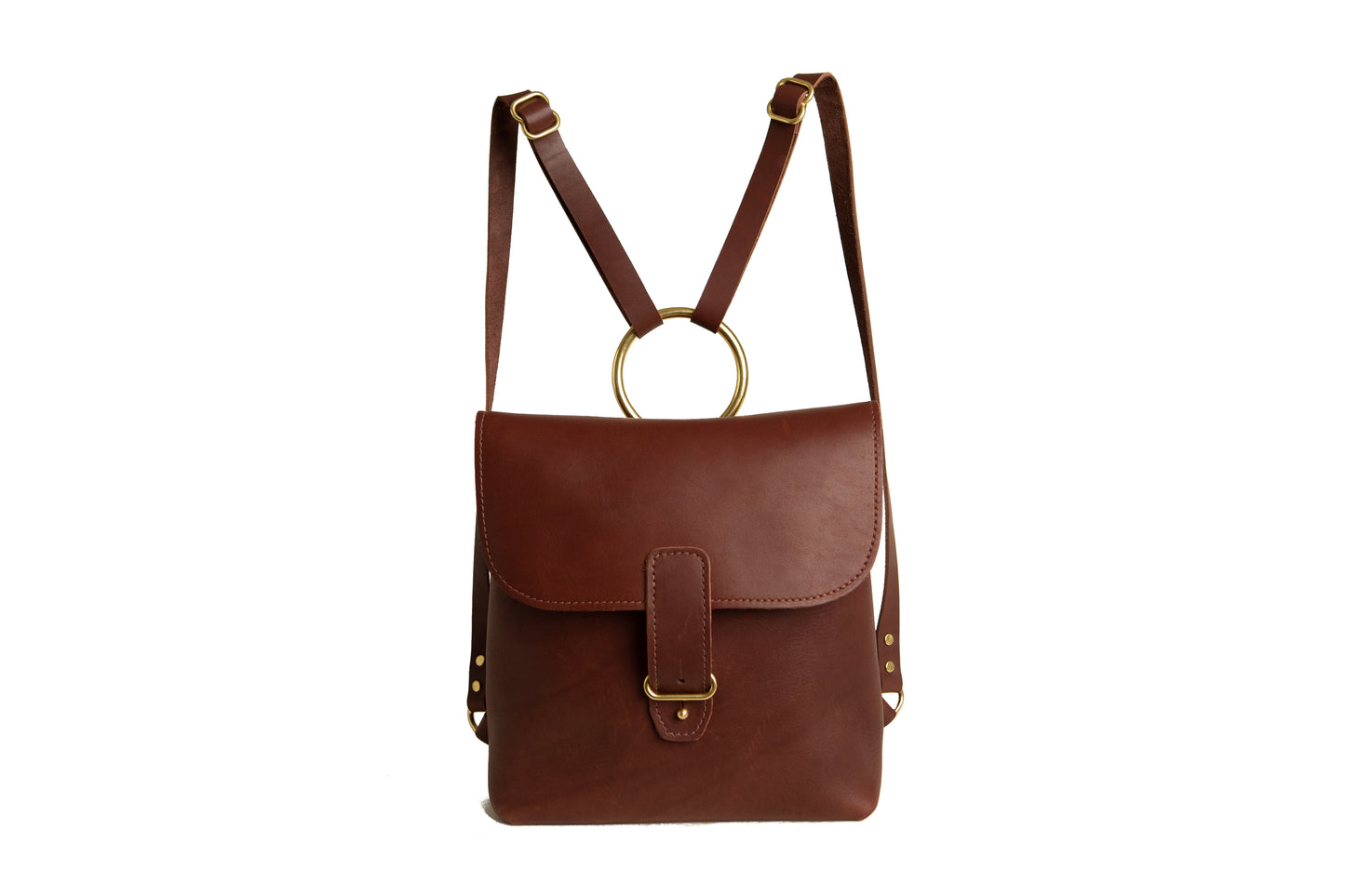 The Urban Southern Monterey Backpack features a brass buckle, a brass ring, brass rivets and additional brass hardware.
