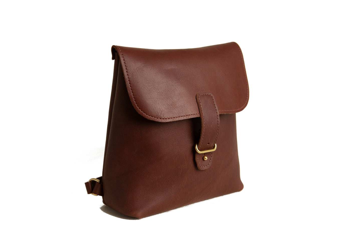 The Urban Southern handcrafted leather Monterey Backpack with adjustable straps and brass hardware, shown in Chestnut Brown.