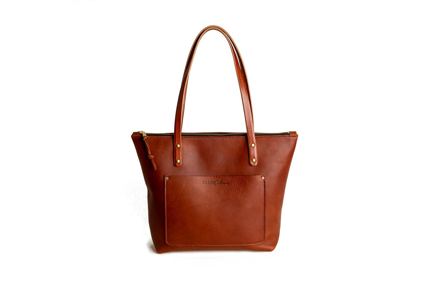 The Urban Zipper Tote, featuring full grain leather & brass details.