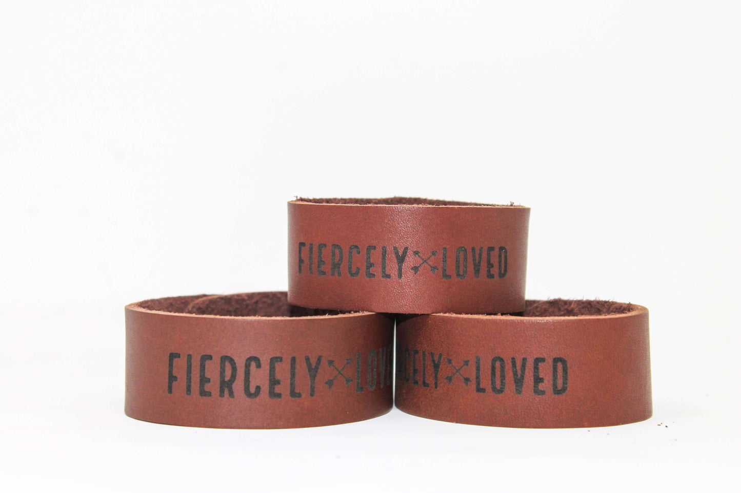 The Fiercely Loved leather cuff bracelet has a beautifully smooth leather texture on the outside with a natural leather texture on the inside.