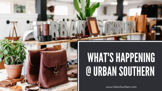 display table with leather bags & accessories, and metal letters that read Urban Southern, with a black box overlay and white script that reads "What's Happening @ Urban Southern"