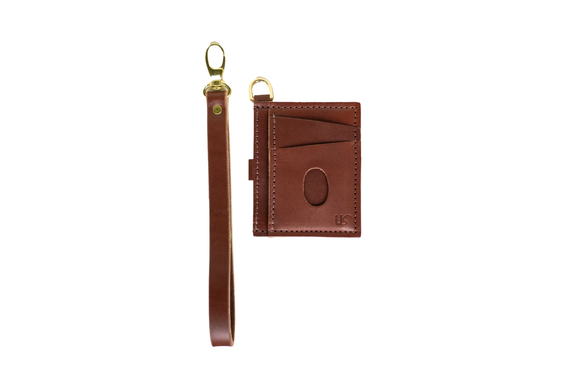 The Urban Southern handcrafted leather Everly Wristlet Wallet in Medium Brown with removable wrist strap, brass hardware, and engraved US abbreviated logo.