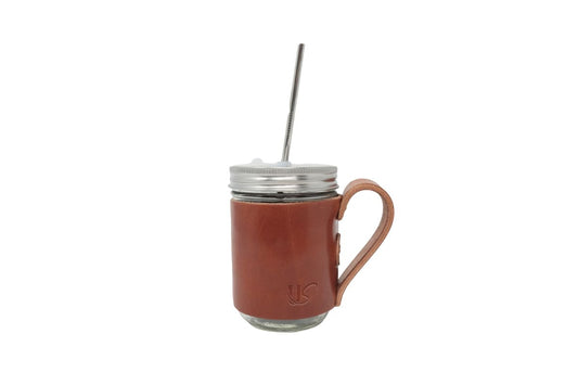 The Mason Jar Mug, featuring full-grain leather wrapped perfectly onto an glass mason jar, includes one metal straw. 