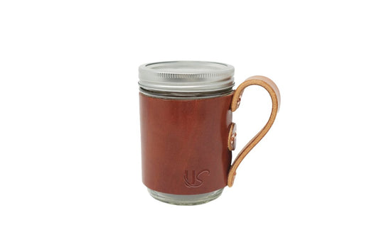 The Mason Jar Mug, featuring full-grain leather wrapped perfectly onto an glass mason jar.