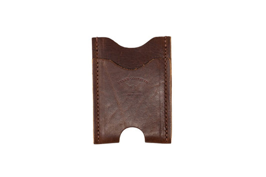 Brown leather money clip wallet on a white background