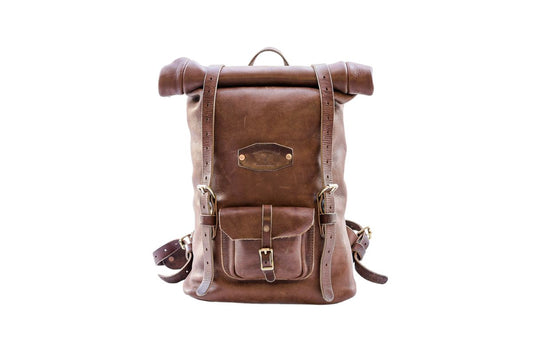 Front view of a brown leather rolltop backpack, featuring adjustable straps