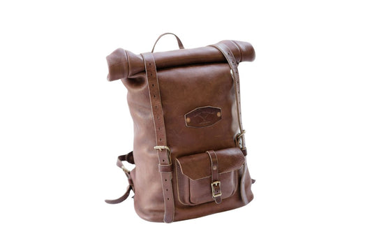 Brown leather rolltop backpack, with adjustable straps on a white background