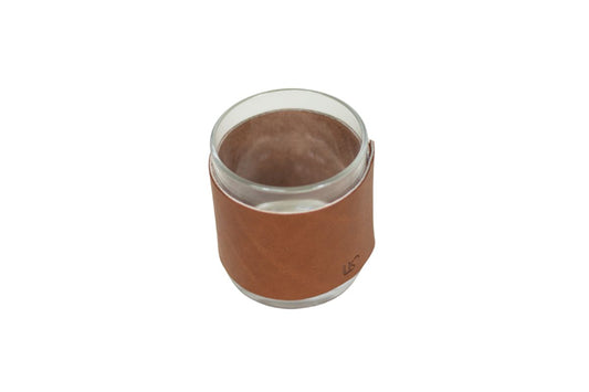 a brown leather wrapped whiskey glass