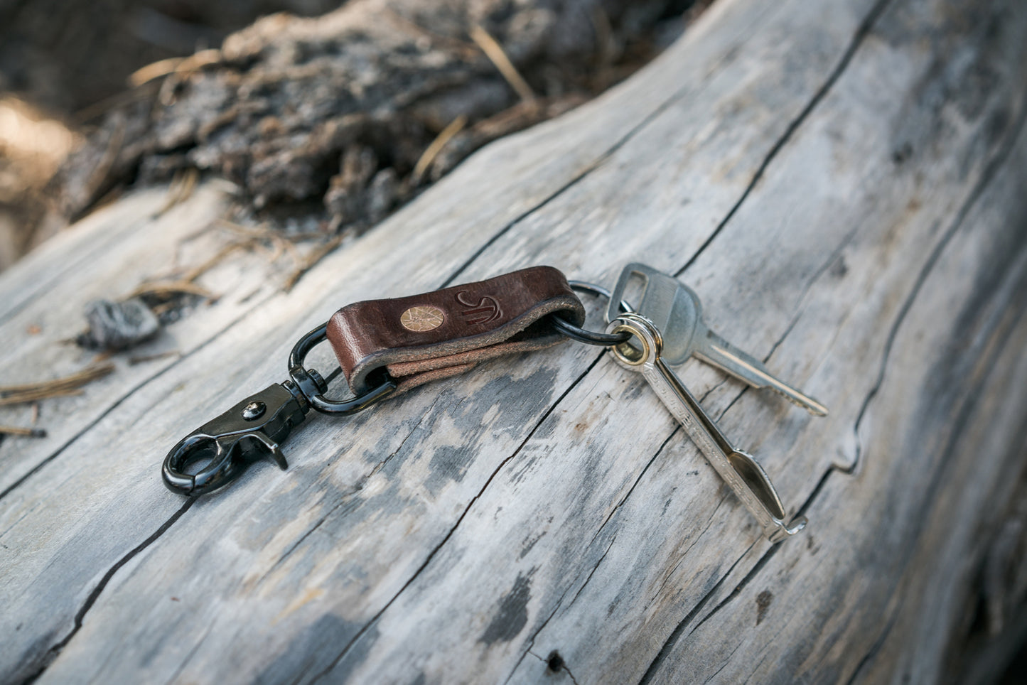 Keychain with keys on a wooden surface