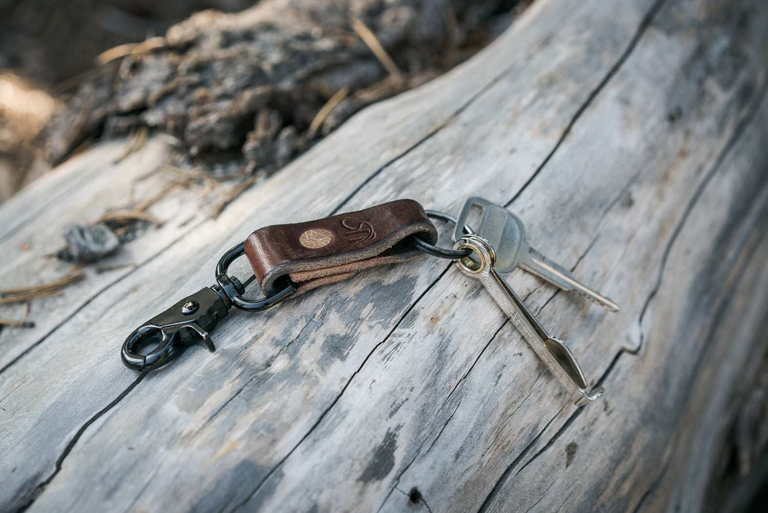Keychain with keys on a wooden surface