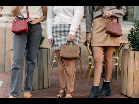 Video tour demonstrating the features of the Cassidy Crossbody. A woman is showcasing the exterior slip pocket & the large interior compartment, perfect for a small wallet, lipgloss, sunglasses etc. 