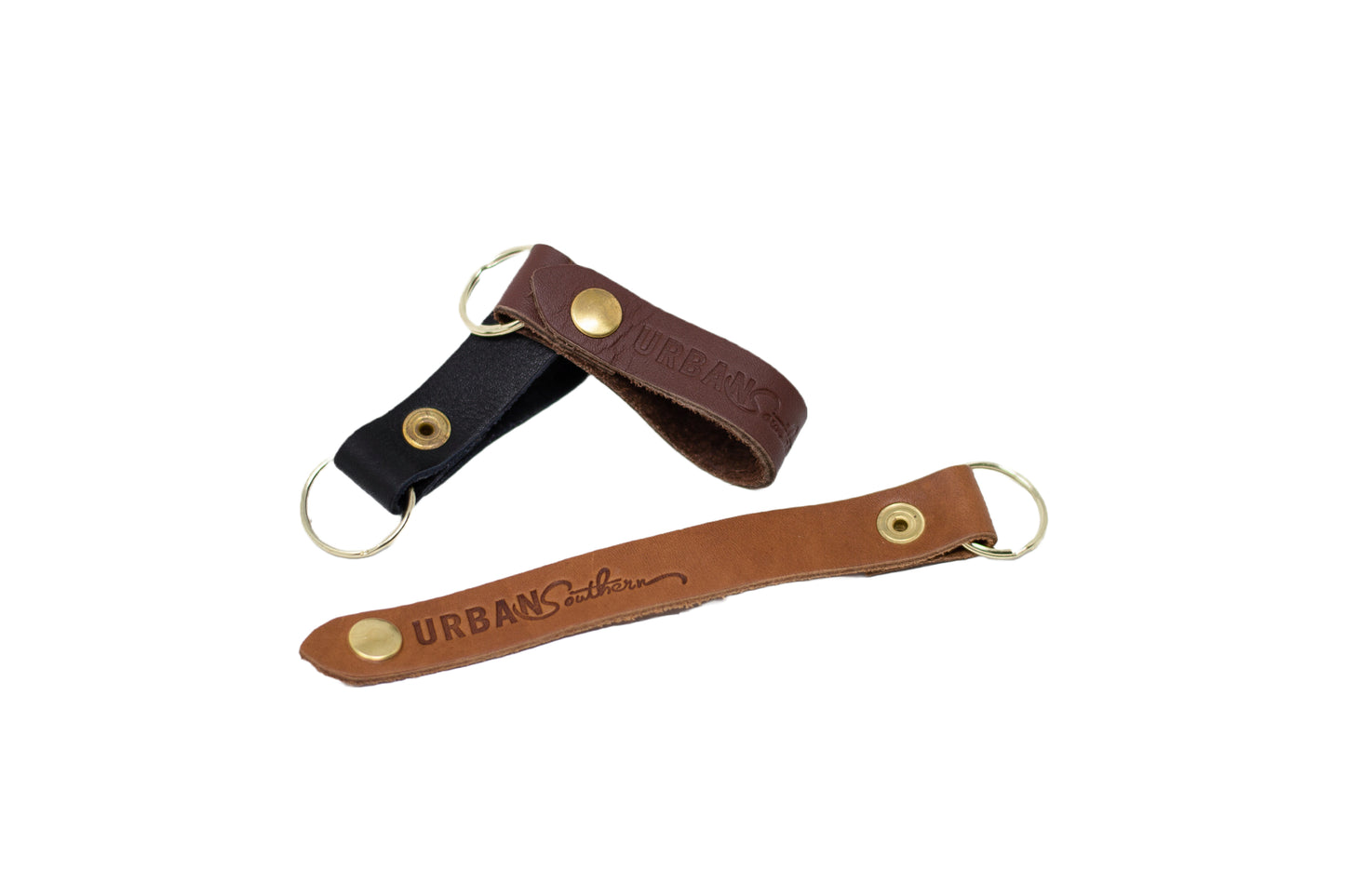 The Urban Key Fob, available in 3 leather colors. Easily opens and closes with its brass snap, attach to a belt loop or handbag strap. 