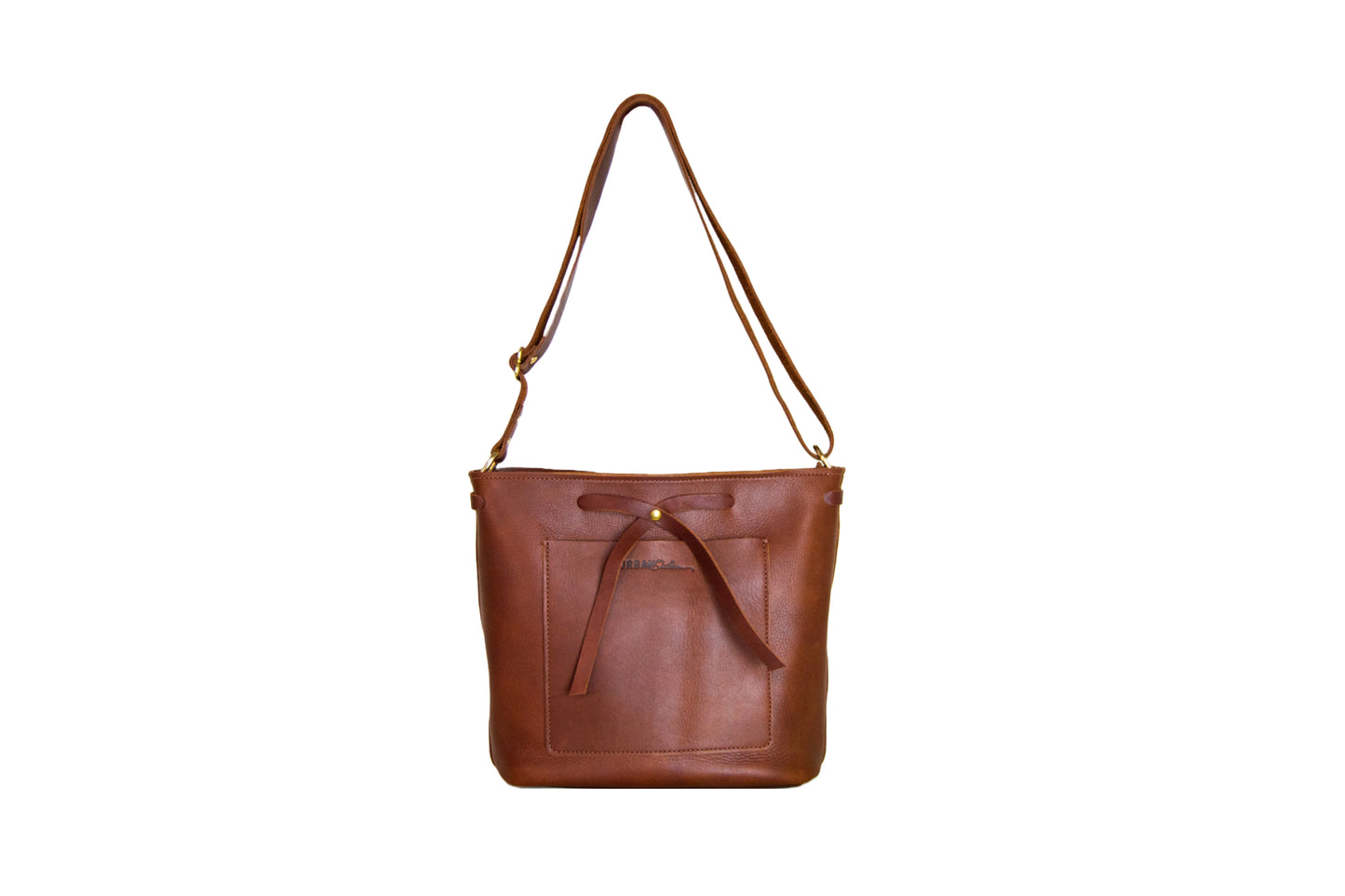 The Lexington Bow leather handbag, handcrafted from full-grain leather & brass hardware. Featuring an exterior slip pocket, two interior pockets & an interior key fob. 