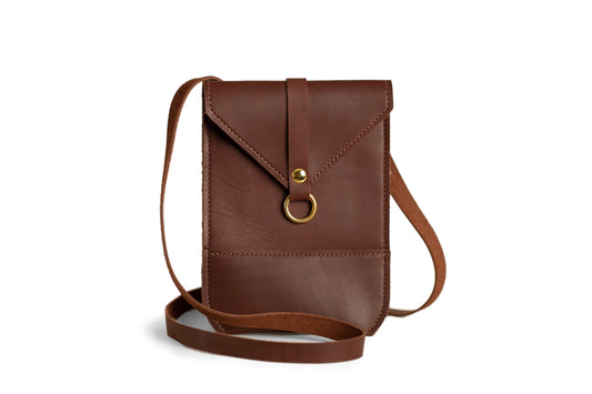 The Postal Crossbody, handcrafted using full-grain leather & brass hardware. 