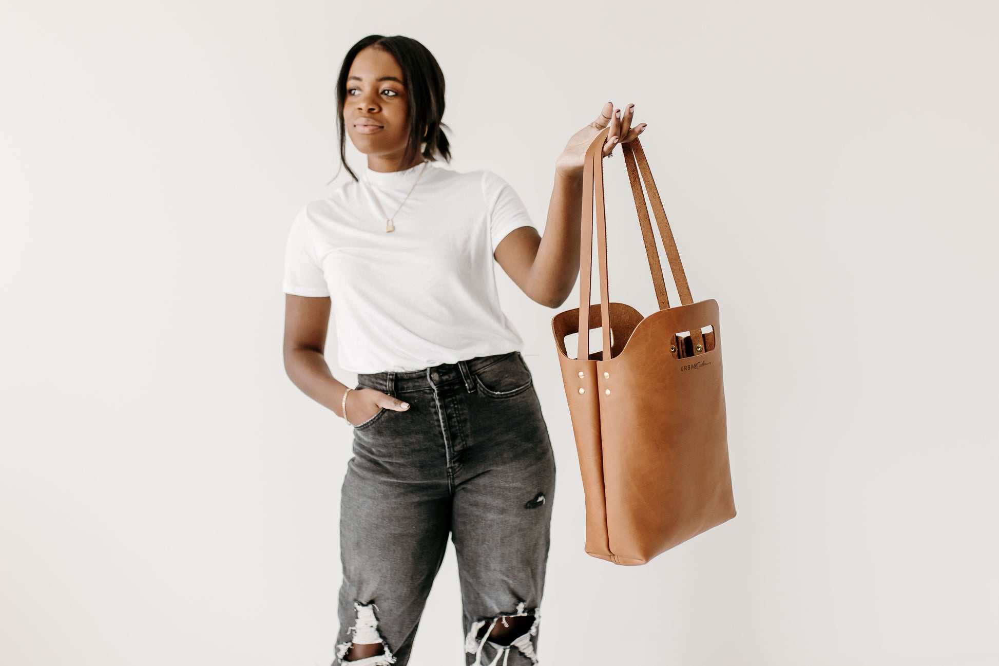 The Mini Market Tote features two straps and two handles.